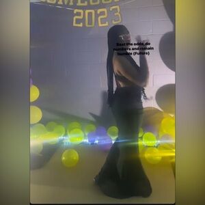 This is a green long dress with the back showing a lil